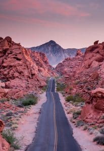 Photo of a road cutting through the rocks in Nevada